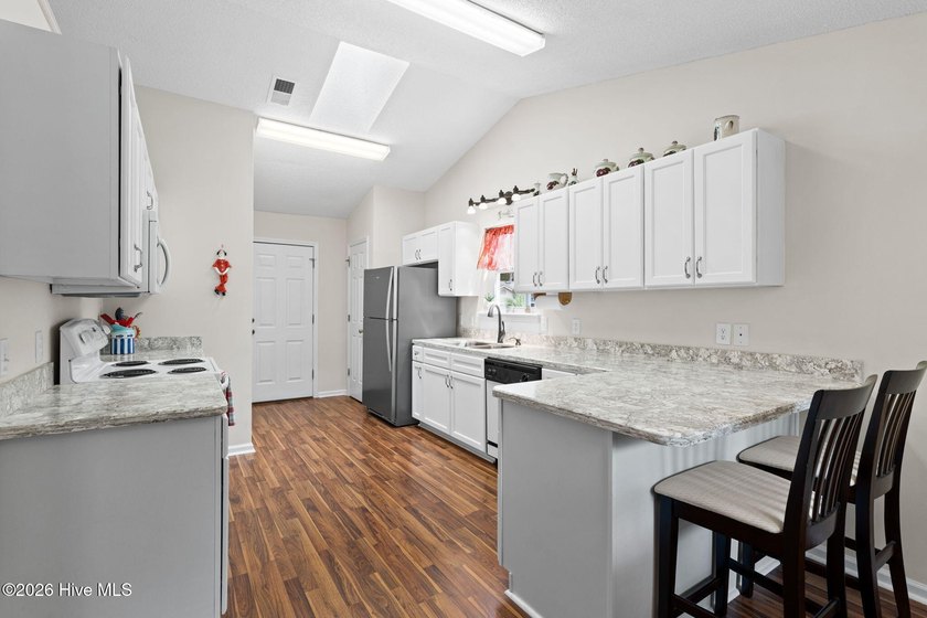 Discover easy coastal living in this beautifully maintained - photo 11