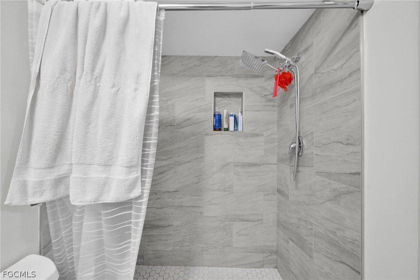 Discover this well-maintained end-unit condo offering comfort - photo 22
