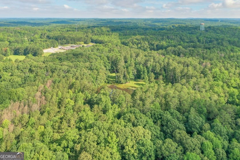 Zoned R-2, the property allows for one home per half-acre and - photo 23
