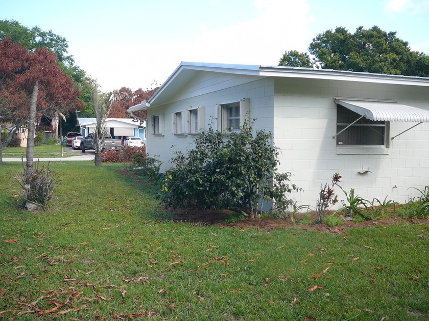 BEAUTIFUL 2/2 WITH CARPORT, CONCRETE BLOCK, NEW METAL ROOF AND - photo 5