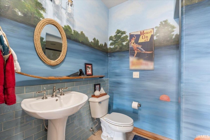 Experience exceptional lakefront living in this custom-built - photo 12