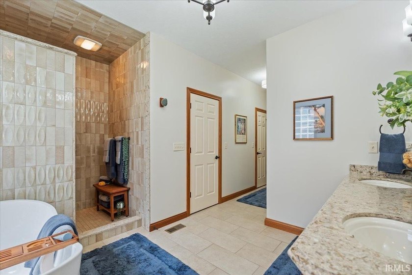 Experience exceptional lakefront living in this custom-built - photo 19