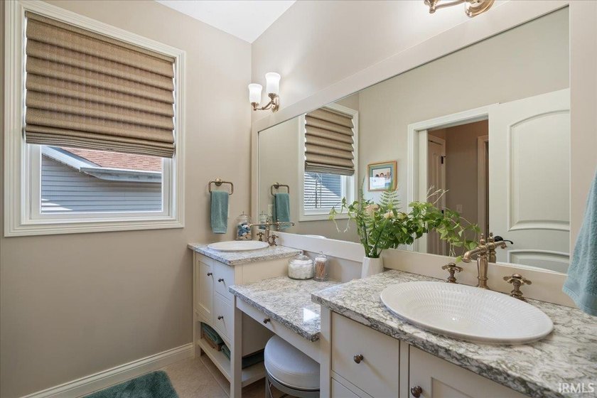 Experience exceptional lakefront living in this custom-built - photo 27