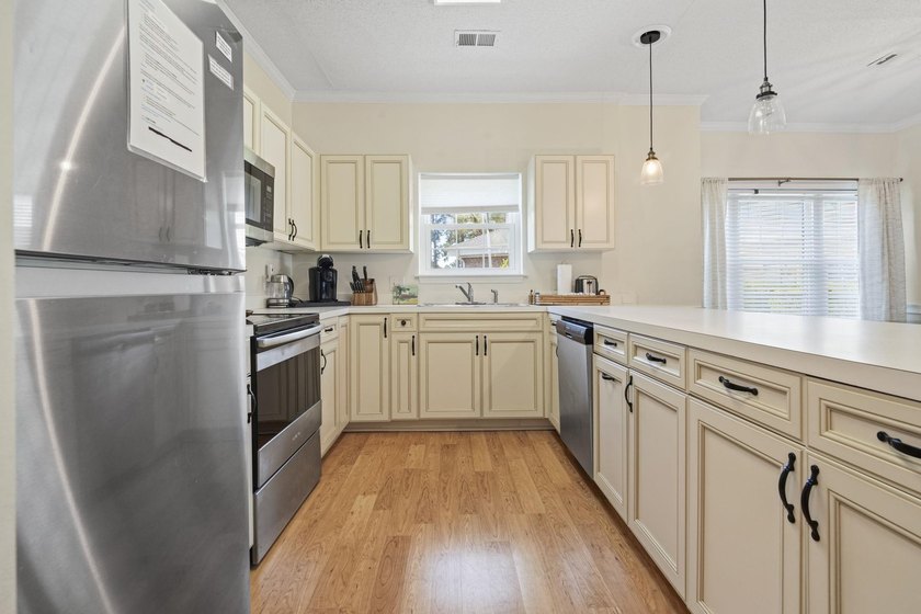 Welcome to this beautiful first-floor end-unit condo in the - photo 5