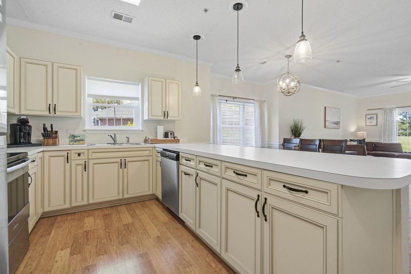 Welcome to this beautiful first-floor end-unit condo in the - photo 7