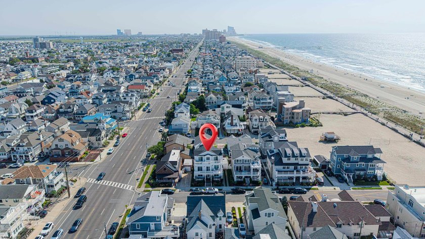 JUST FOUR HOMES FROM THE BEACH! Welcome to one of the most - photo 3