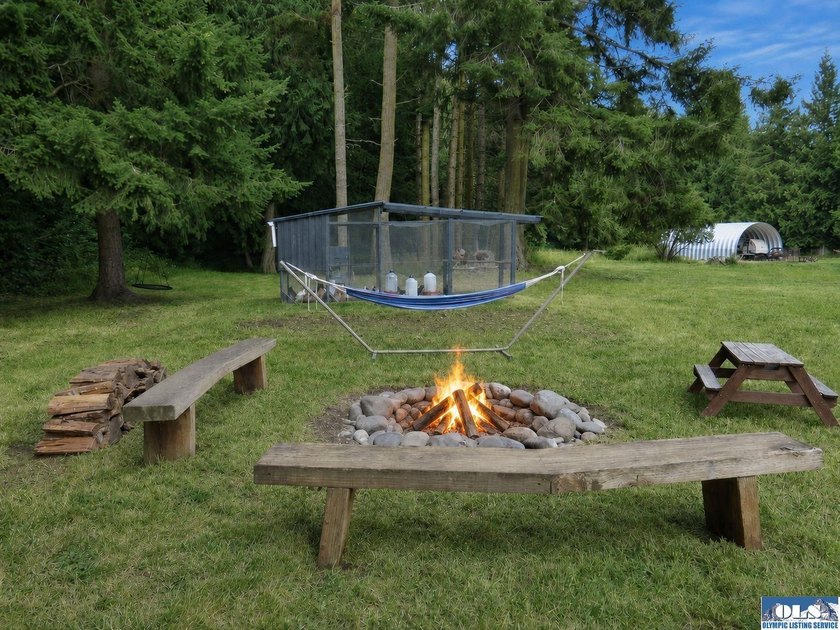 Tucked among mature trees and lovingly maintained, this inviting - photo 22