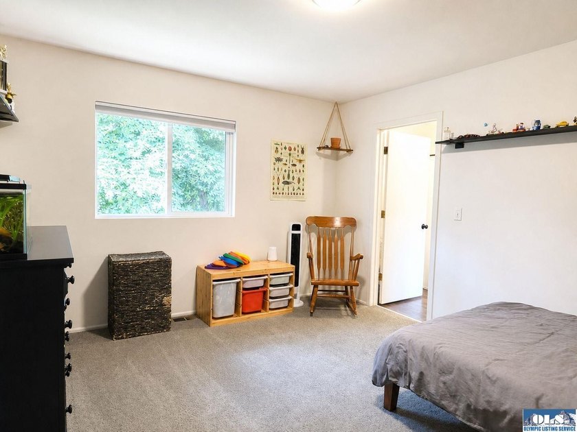 Tucked among mature trees and lovingly maintained, this inviting - photo 50