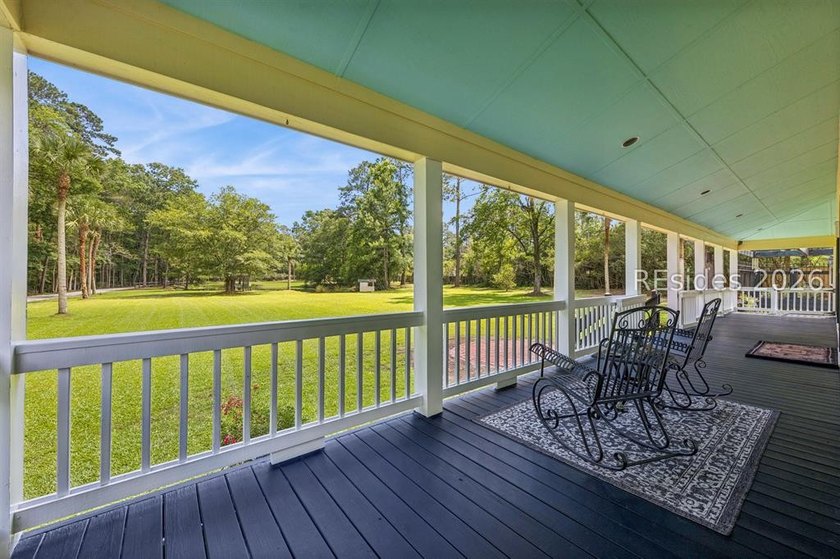 Tucked behind wrought iron gates on over four private, fenced - photo 10