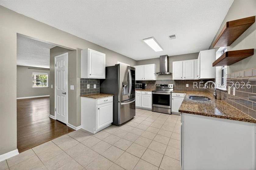 Set on a quiet cul-de-sac, 41 Lakeside Drive offers a sense of - photo 10