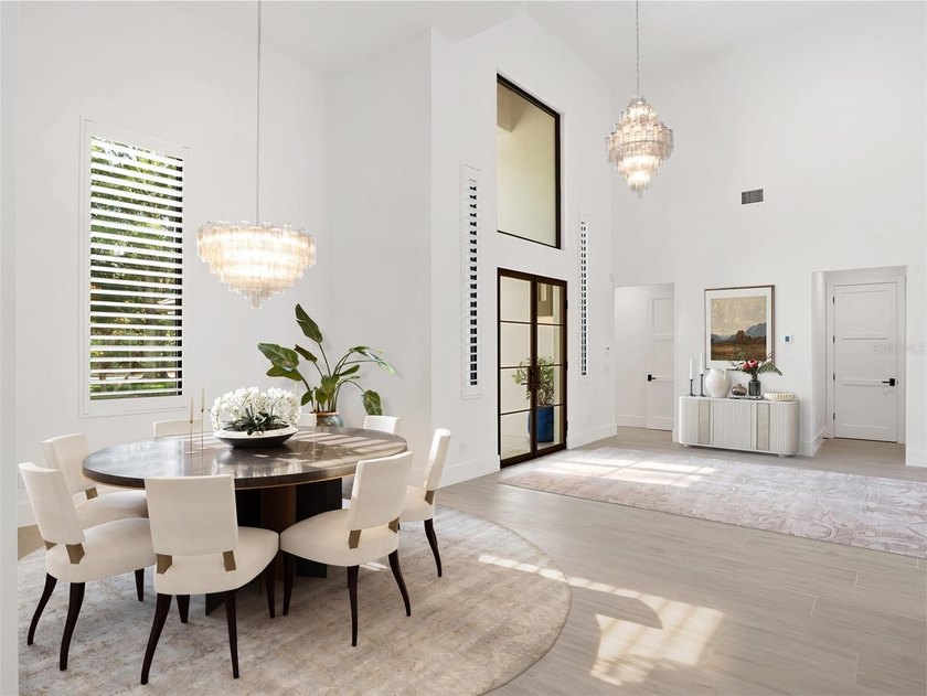 Set within the gates of renowned Isleworth, this beautifully - photo 4