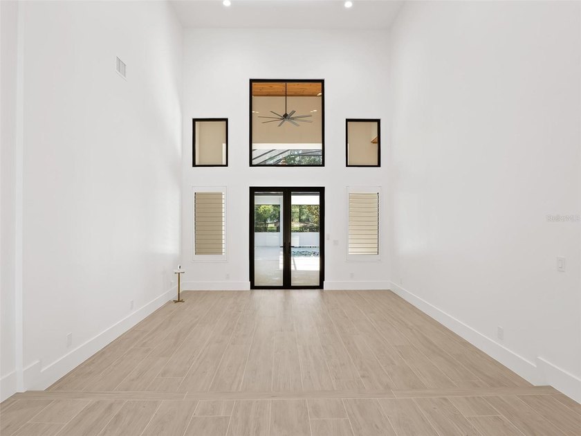 Set within the gates of renowned Isleworth, this beautifully - photo 7
