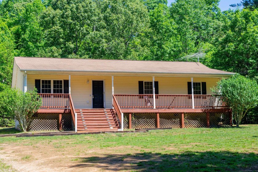 Welcome to this charming water access home on the public side of - photo 2