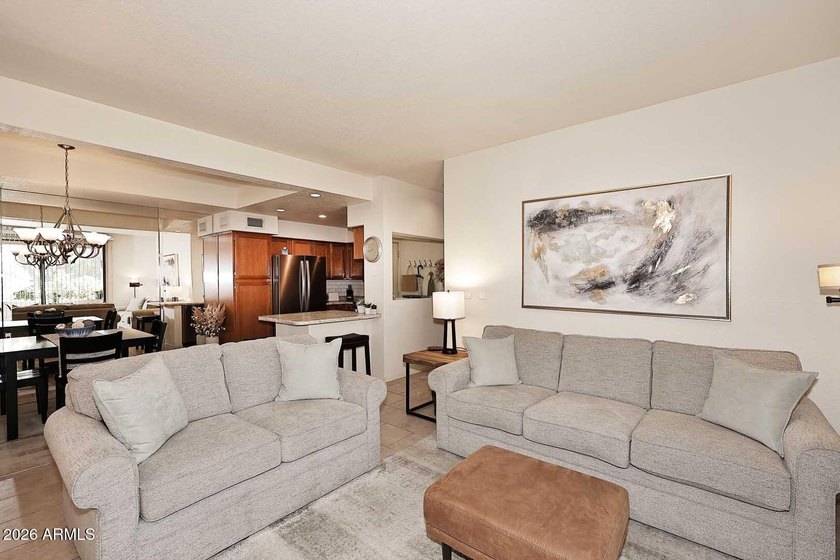 Ideal interior location with south facing patios on the big - photo 4