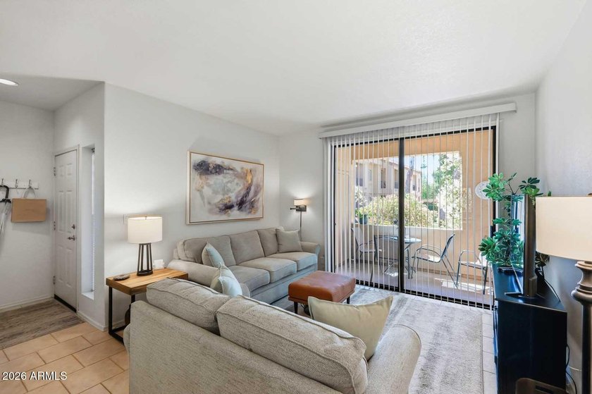 Ideal interior location with south facing patios on the big - photo 5