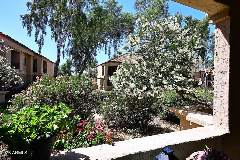 Ideal interior location with south facing patios on the big - photo 6