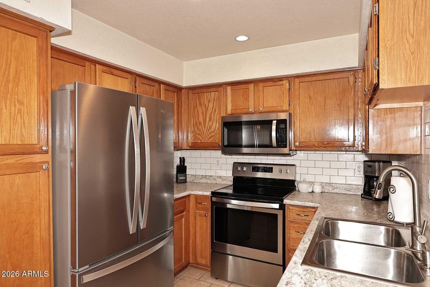 Ideal interior location with south facing patios on the big - photo 8