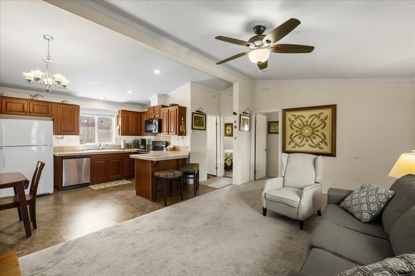 Welcome home to this charming 3-bedroom, 2-bath residence tucked - photo 7