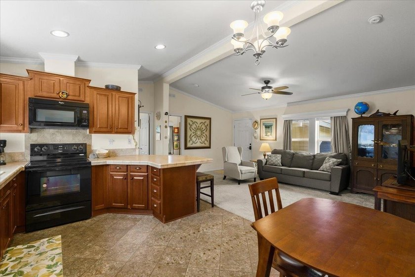 Welcome home to this charming 3-bedroom, 2-bath residence tucked - photo 9