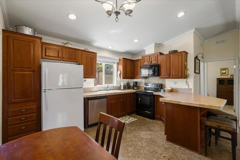 Welcome home to this charming 3-bedroom, 2-bath residence tucked - photo 10
