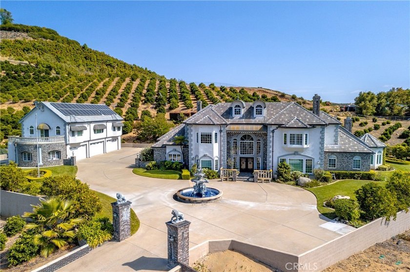 Positioned atop 20.22 fully fenced and gated acres, this stately - photo 5