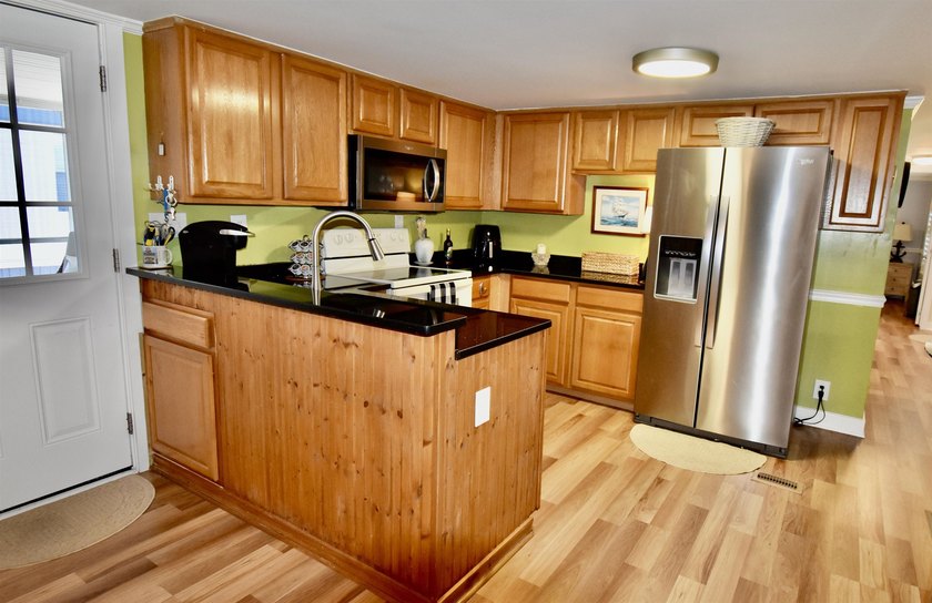 This charming 2-bedroom, 2-bath mobile home offers the perfect - photo 3