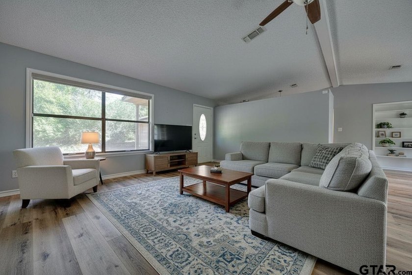 Nestled on a quiet street, this inviting residence blends - photo 4