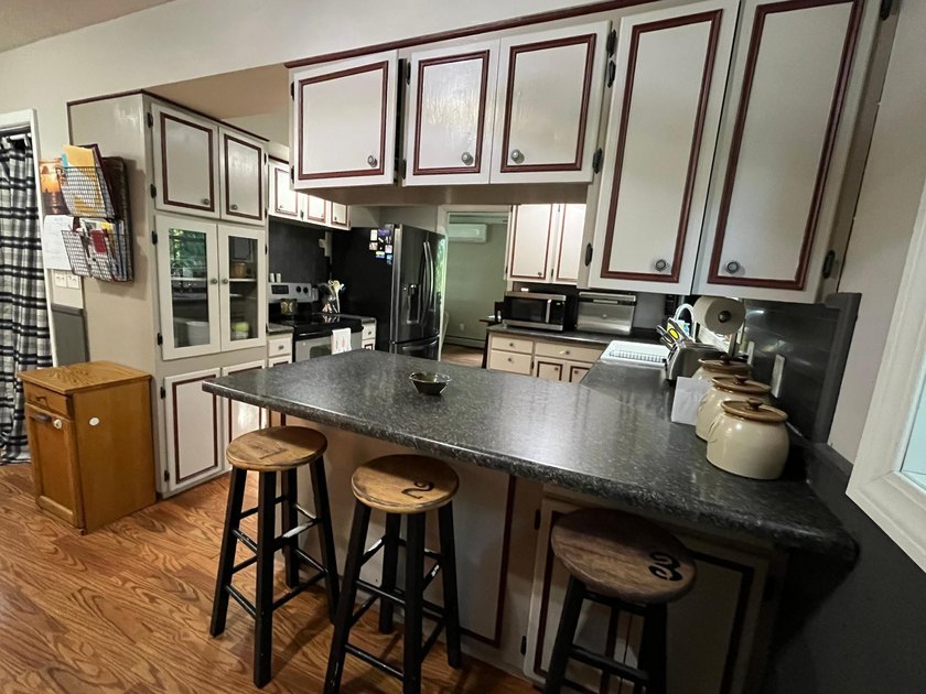 This spacious 5-bed, 3-bath walk-out home on Rainy River offers - photo 8