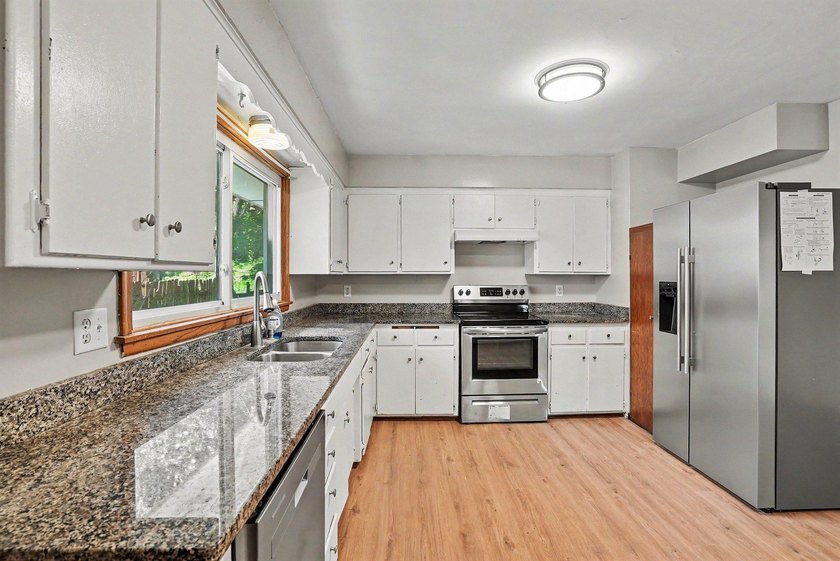 Welcome to this updated Rambler home located just minutes away - photo 5