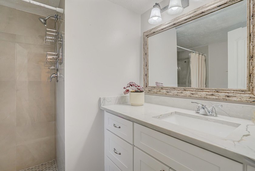 Move in ready 1st FLOOR condo in the desirable 55+ community of - photo 3