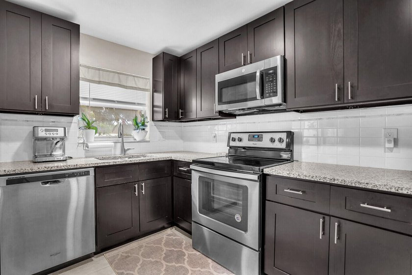 Move in ready 1st FLOOR condo in the desirable 55+ community of - photo 9