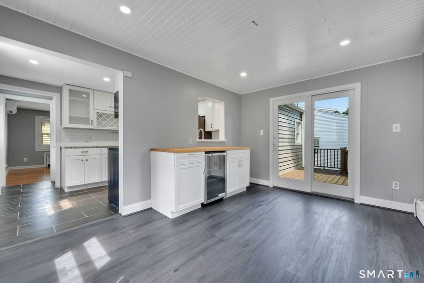 Beautifully updated and deceptively spacious, this move-in ready - photo 11
