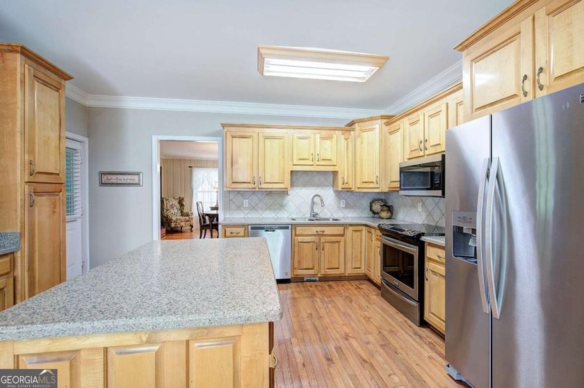 Nestled on 2.83 beautifully landscaped acres surrounded by - photo 10