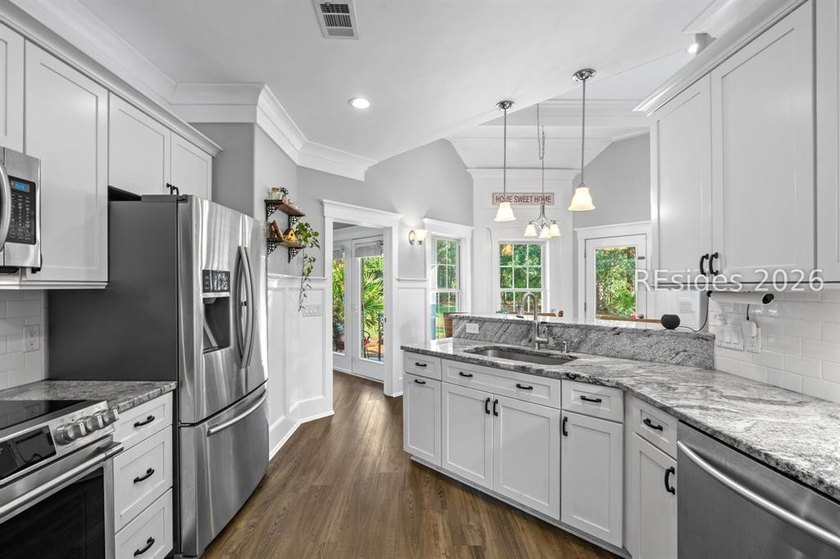 On a generous 0.63-acre corner lot in golf cart-friendly - photo 11