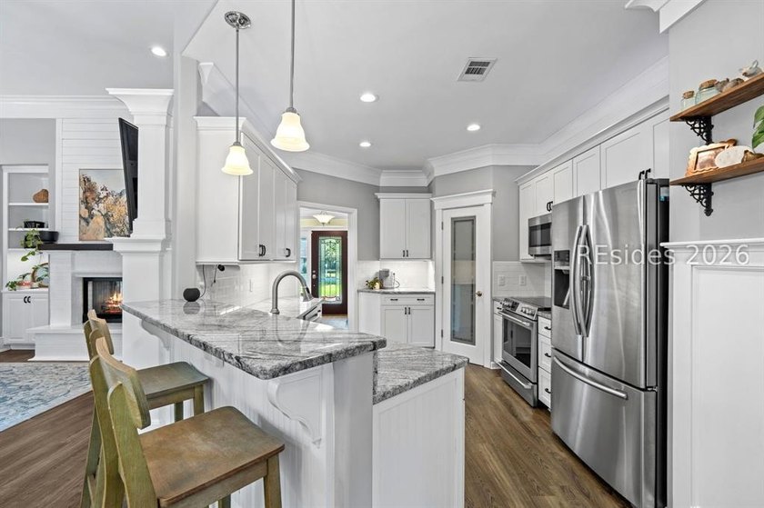 On a generous 0.63-acre corner lot in golf cart-friendly - photo 12