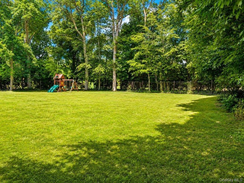 Tucked away at the end of a quiet cul-de-sac, this .62-acre - photo 3