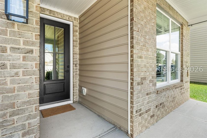 Tucked away on a private, wooded lot, this stunning single-story - photo 4