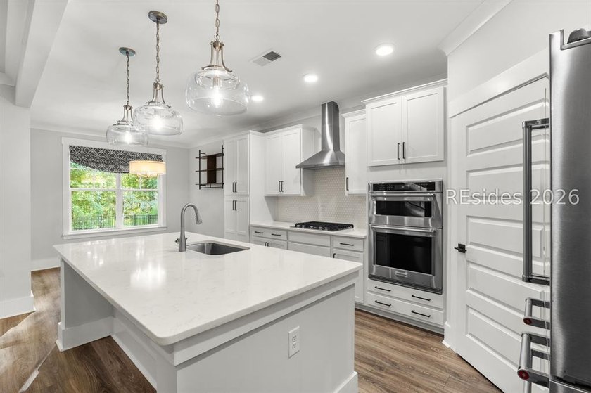 Tucked away on a private, wooded lot, this stunning single-story - photo 8