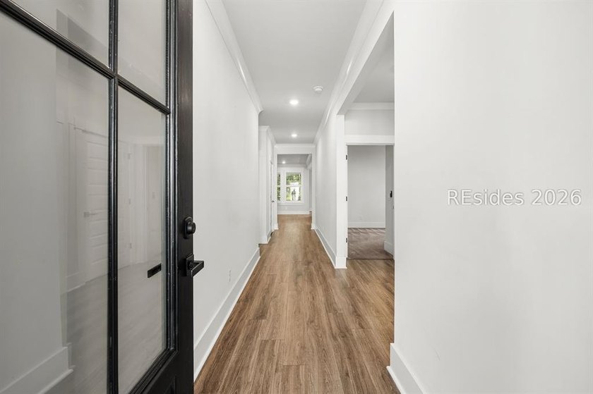 Tucked away on a private, wooded lot, this stunning single-story - photo 9