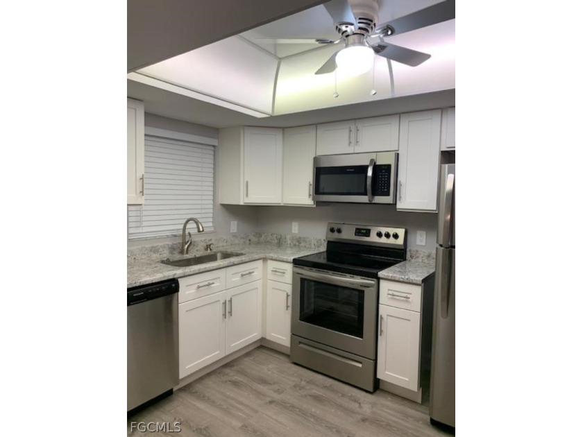 First-floor end unit in desirable Cross Creek Country Club - no - photo 3