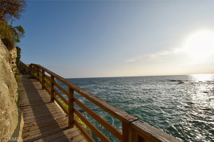 Escape to an exquisite, fully furnished oceanfront retreat that - photo 37