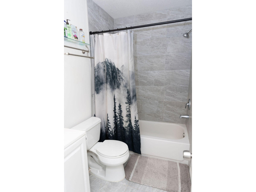 This charming home features updated kitchen and bathrooms with - photo 27