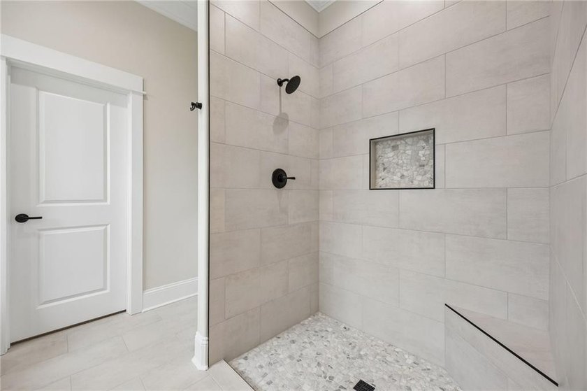 NEWLY COMPLETED AND BEAUTIFULLY DESIGNED, THIS 4-BEDROOM, 3-BATH - photo 32