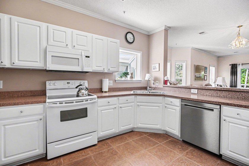 Enjoy beautiful golf course views from this bright and spacious - photo 5
