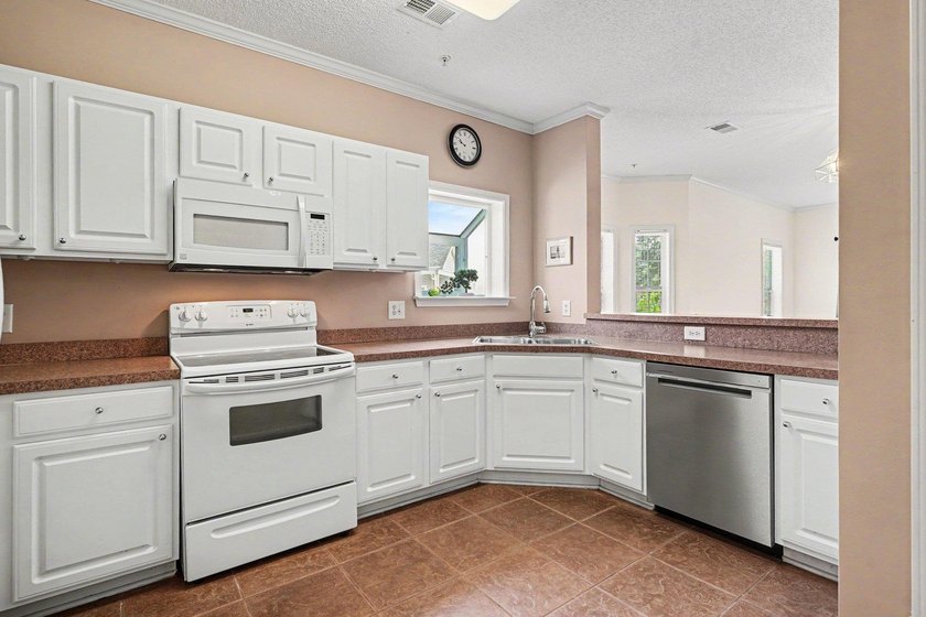 Enjoy beautiful golf course views from this bright and spacious - photo 6