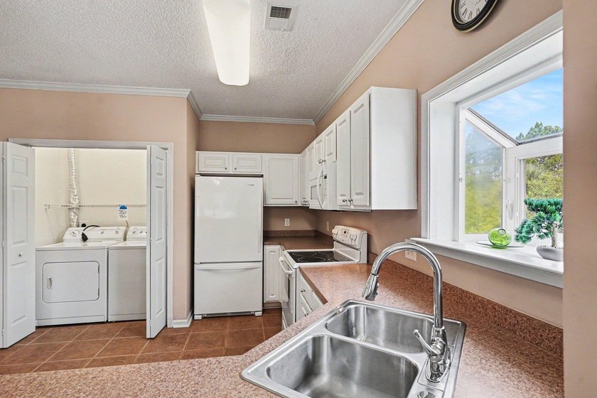 Enjoy beautiful golf course views from this bright and spacious - photo 8