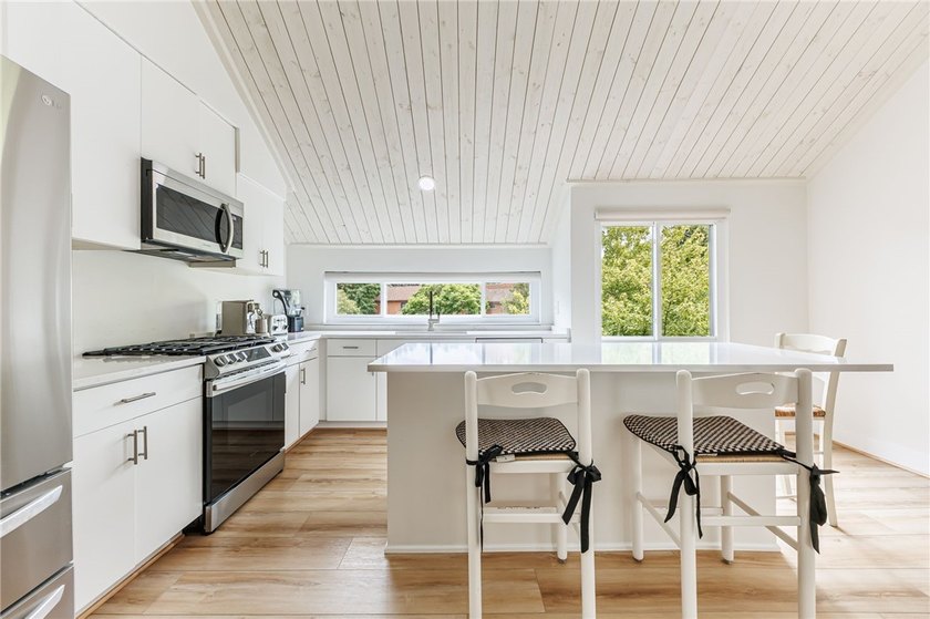 Wow! Incredible updates throughout! Tri-level living. Each of - photo 12