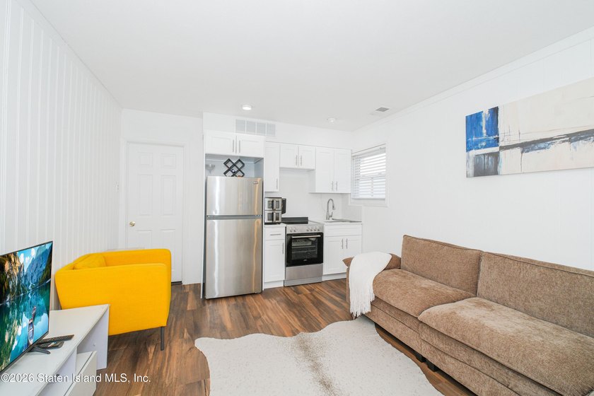 Welcome to 191 Suffolk Avenue, a warm and inviting two-family - photo 14