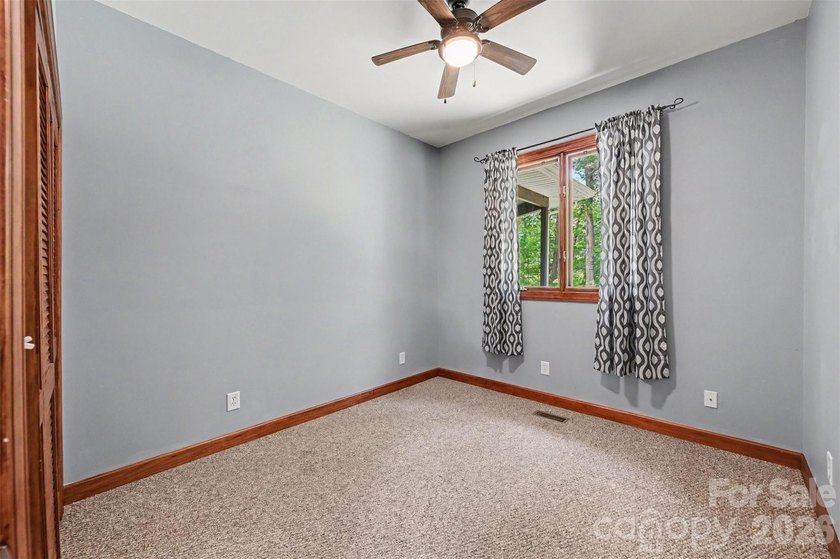 Tucked away on over 4 private wooded acres in the desirable - photo 26