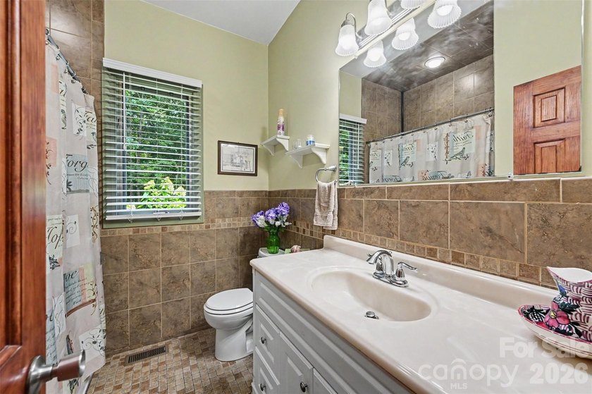 Tucked away on over 4 private wooded acres in the desirable - photo 27